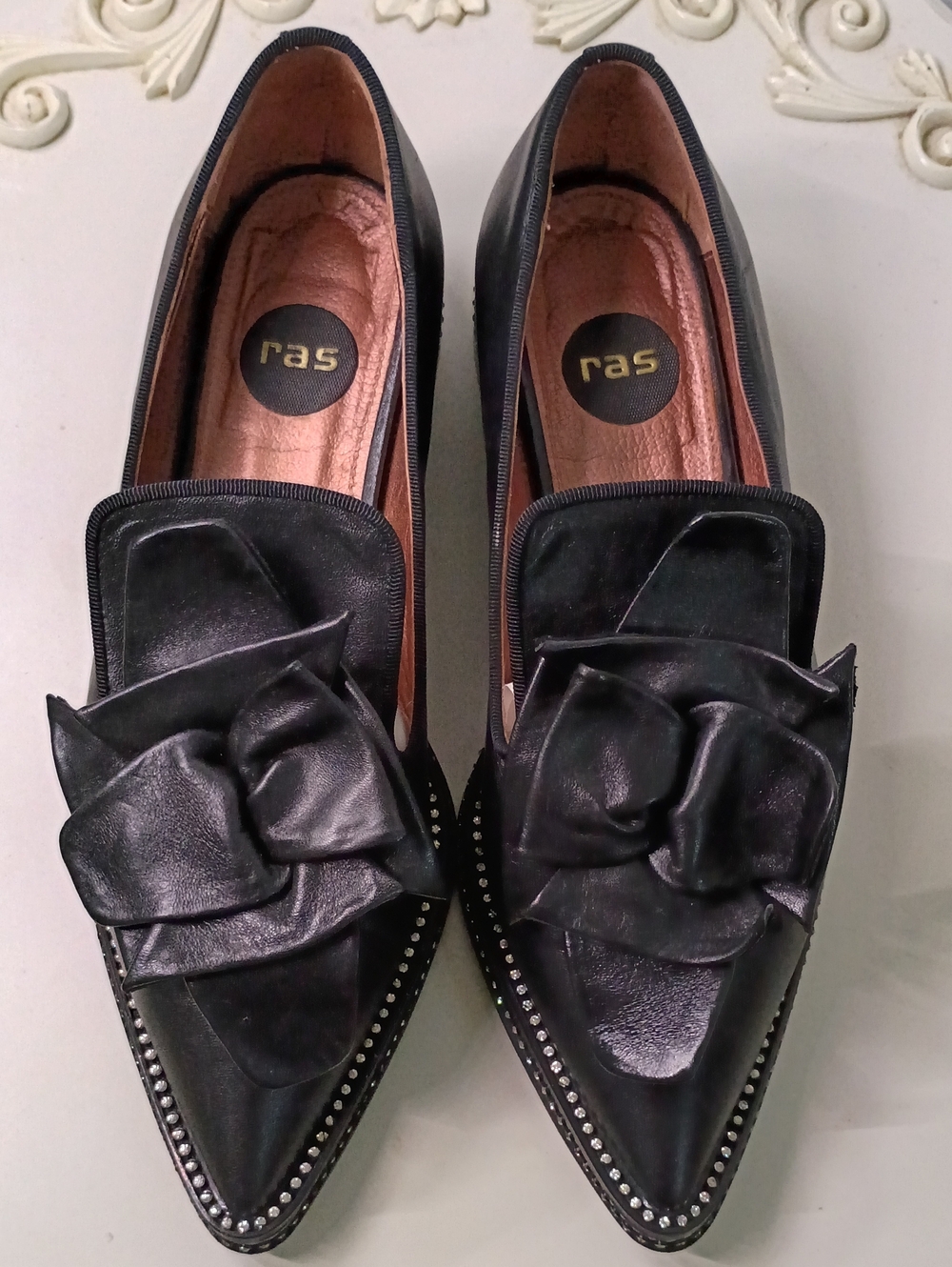 RAS Black Leather Pointed Loafers with Rosette Accent